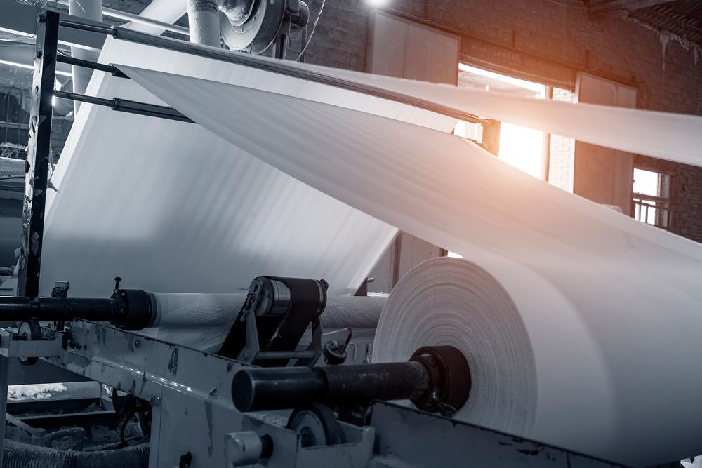 Paper converting machinery with large paper rolls